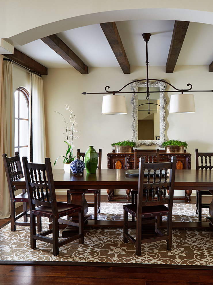 Inspiration for a large mediterranean dining room in San Francisco with beige walls and dark hardwood floors.