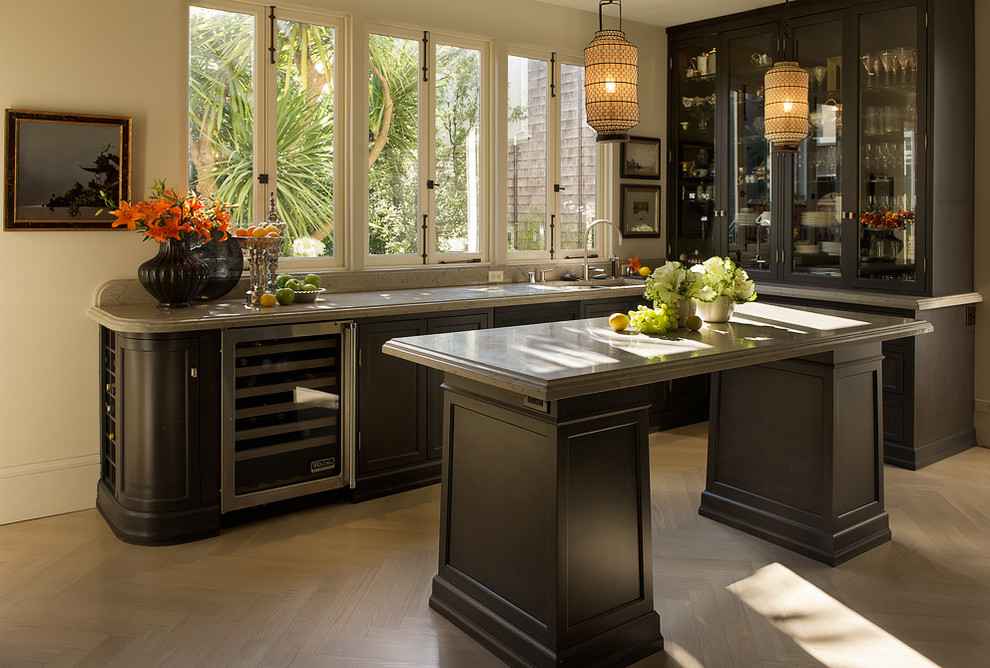 Design ideas for a contemporary l-shaped kitchen in San Francisco with glass-front cabinets and dark wood cabinets.