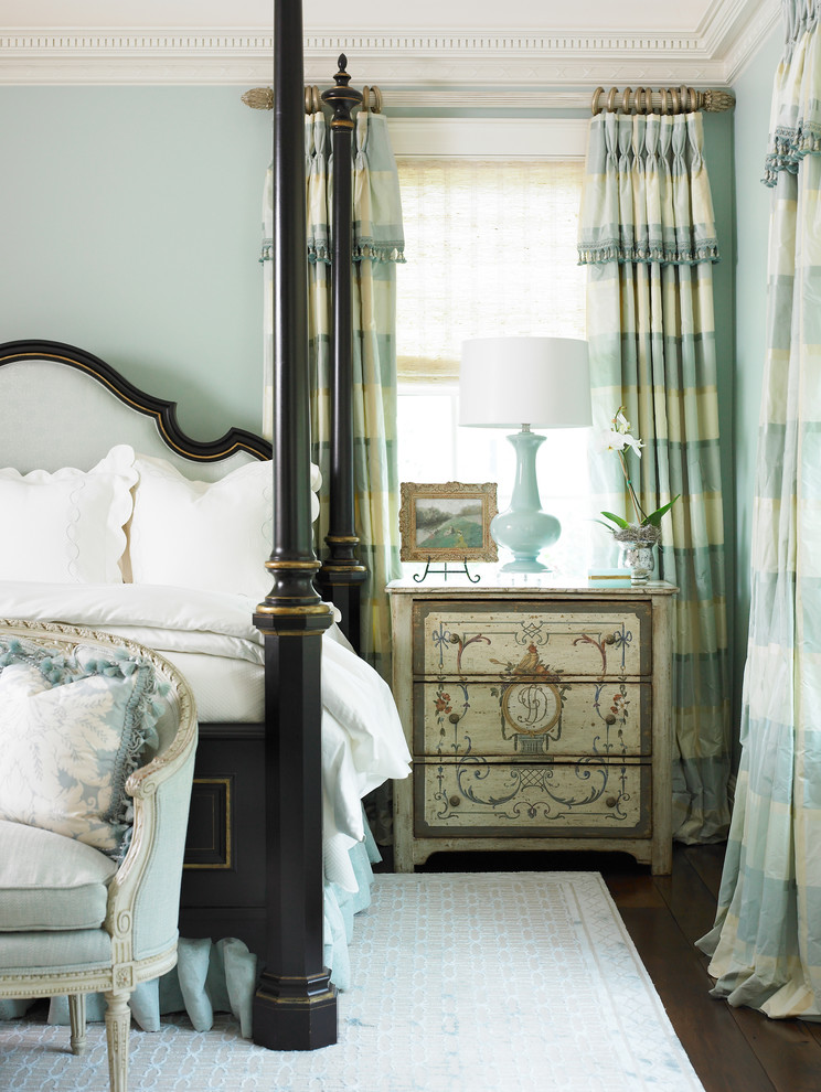 Design ideas for a large traditional master bedroom in Atlanta with blue walls and dark hardwood floors.