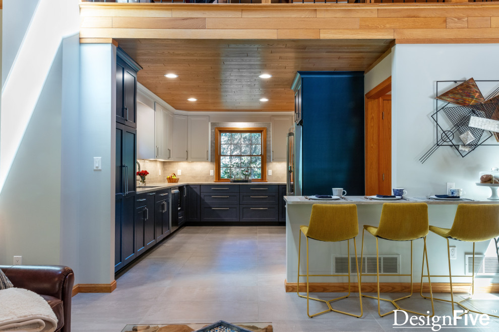 Example of a large minimalist u-shaped gray floor and wood ceiling open concept kitchen design with an undermount sink, shaker cabinets, blue cabinets, quartz countertops, gray backsplash, ceramic backsplash, stainless steel appliances and no island