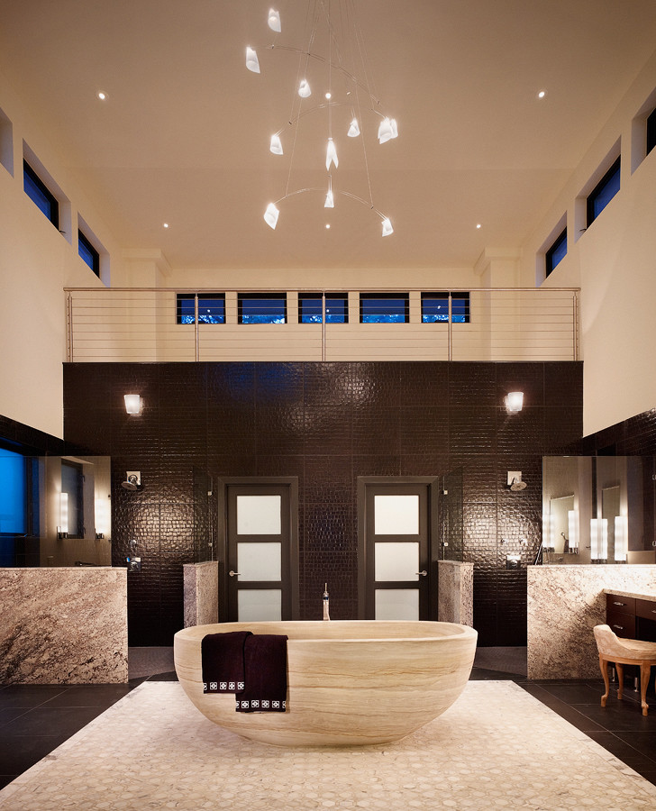 Design ideas for an expansive modern master bathroom in Austin with flat-panel cabinets, dark wood cabinets, a freestanding tub, a corner shower, beige tile, brown tile, beige walls, ceramic floors and granite benchtops.