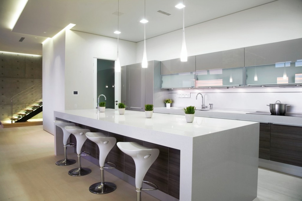 This is an example of a modern galley kitchen in Other with glass-front cabinets and grey cabinets.