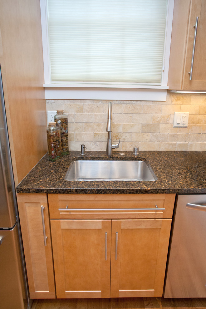 Example of a small transitional galley medium tone wood floor eat-in kitchen design with an undermount sink, recessed-panel cabinets, light wood cabinets, quartz countertops, beige backsplash, stone tile backsplash, white appliances, beige walls and no island