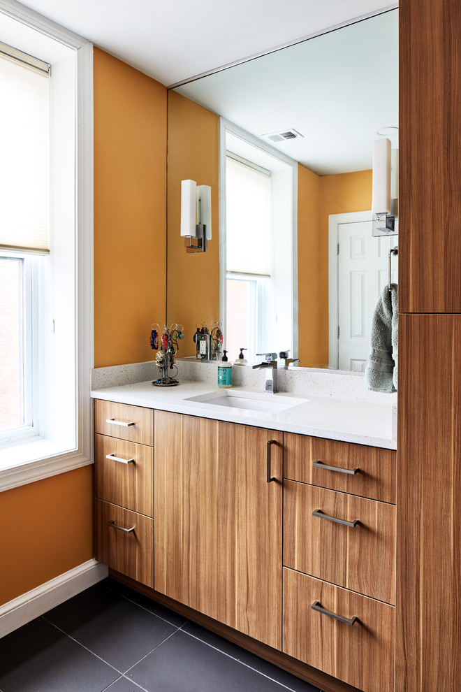 Design ideas for a mid-sized modern master wet room bathroom in DC Metro with flat-panel cabinets, an alcove tub, a two-piece toilet, orange tile, ceramic tile, orange walls, porcelain floors, an undermount sink, engineered quartz benchtops, black floor, a hinged shower door and white benchtops.