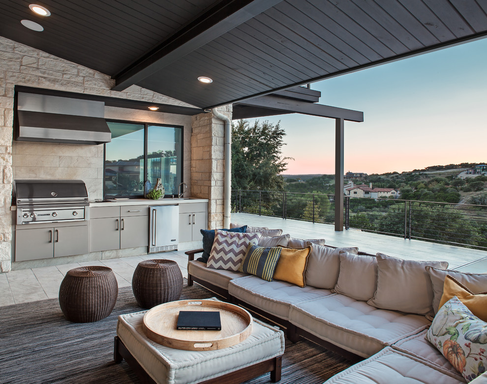 Mid-sized contemporary backyard patio in Austin with concrete slab and a roof extension.