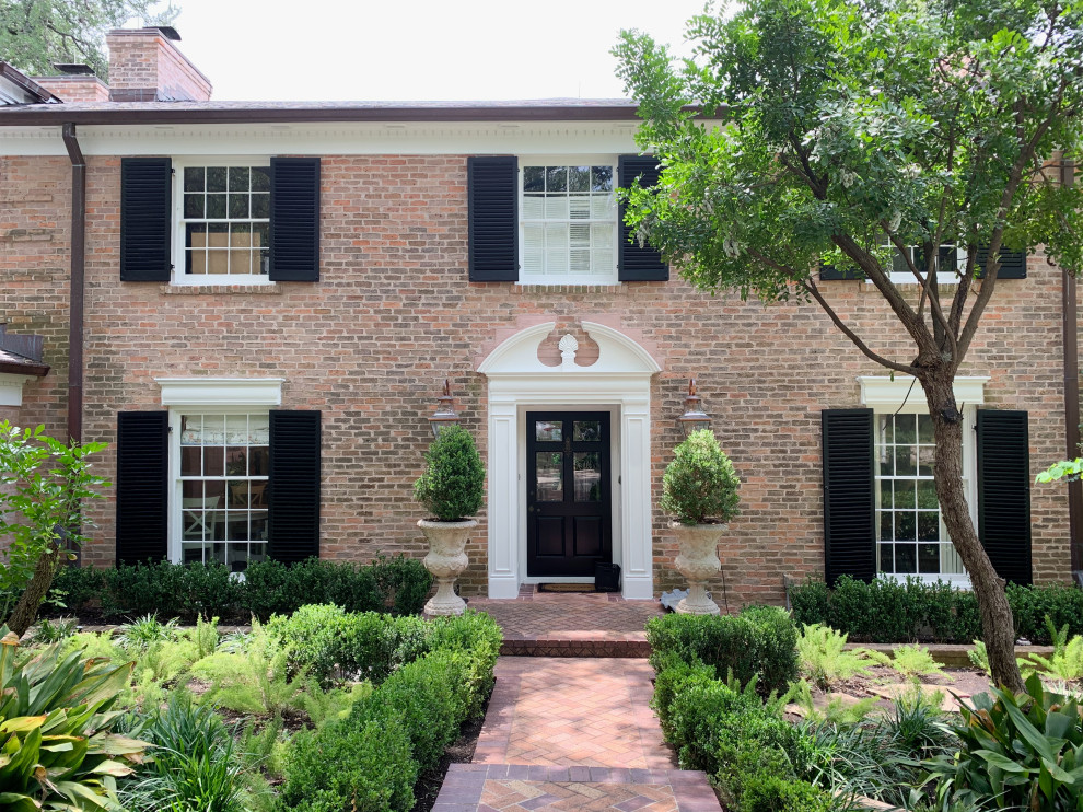 Traditional Brick Classic Home with White Trim and Black ...
