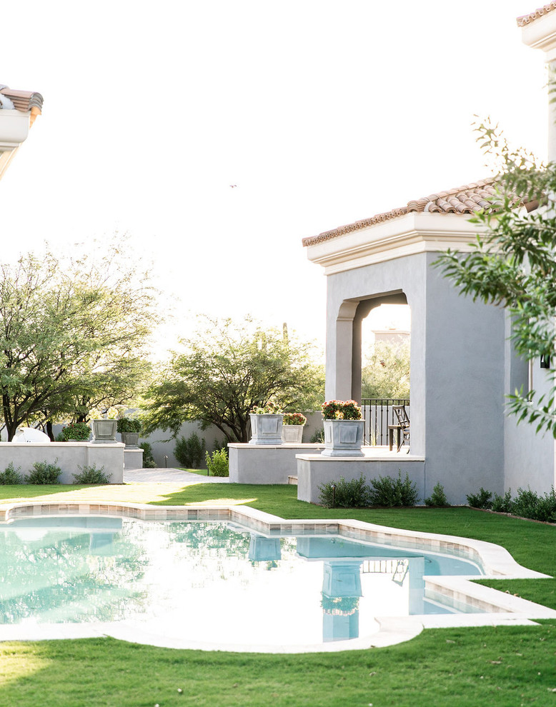 Example of a transitional exterior home design in Phoenix
