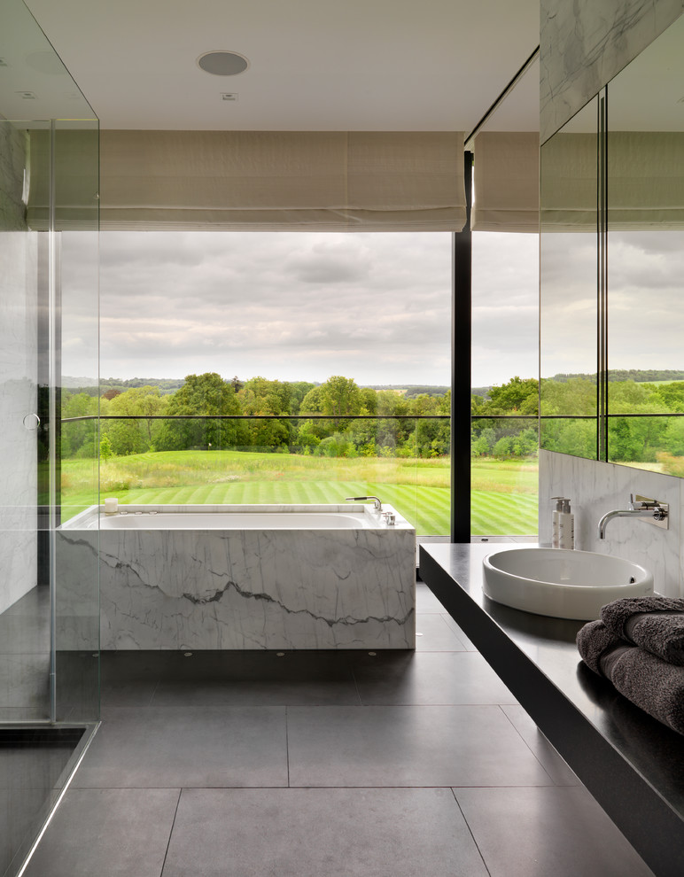 Inspiration for a contemporary bathroom in London with a freestanding tub.