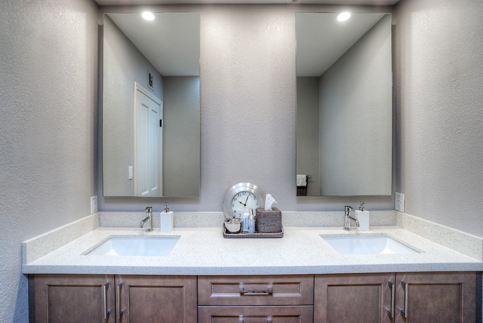 Mid-sized contemporary kids bathroom in Phoenix with an undermount sink, grey cabinets, quartzite benchtops, gray tile, grey walls, ceramic tile, terra-cotta floors, shaker cabinets, a one-piece toilet and grey floor.
