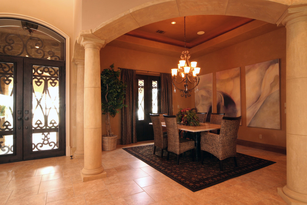 Mid-sized mediterranean open plan dining in Austin with beige walls and travertine floors.