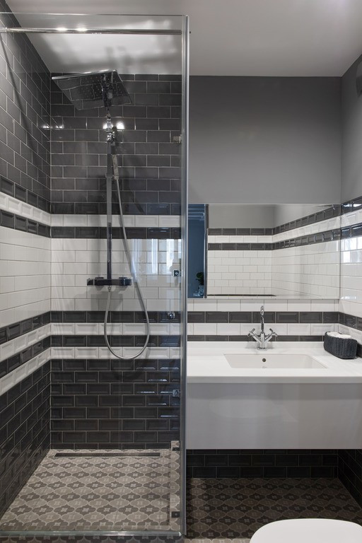 Design ideas for a medium sized traditional ensuite wet room bathroom in Other with white walls, raised-panel cabinets, white cabinets, an alcove bath, a wall mounted toilet, white tiles, ceramic flooring, a submerged sink, beige floors, white worktops, double sinks and a freestanding vanity unit.