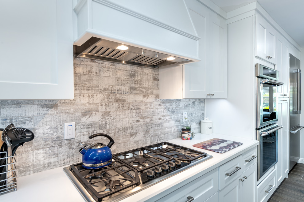 Example of a mid-sized transitional kitchen design in Orange County