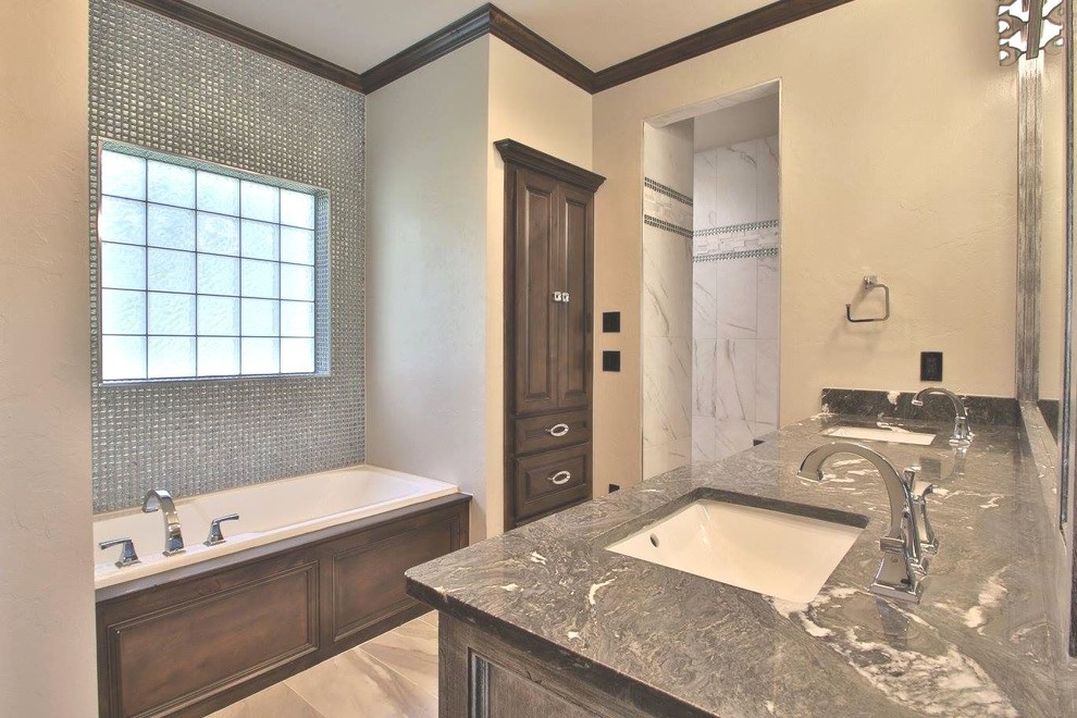 Alcove bathtub - master gray tile and glass tile beige floor alcove bathtub idea in Phoenix with gray cabinets, beige walls and gray countertops