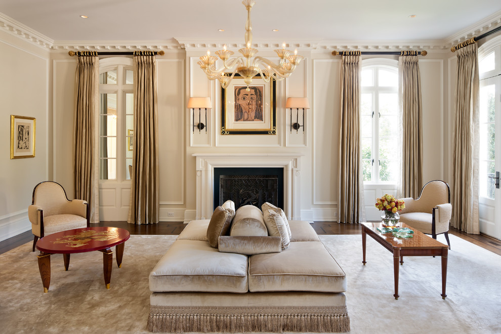 This is an example of a traditional formal living room in New York with beige walls and a standard fireplace.