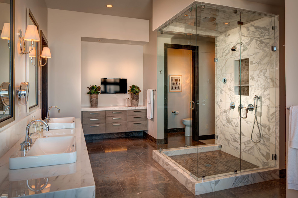 This is an example of a contemporary bathroom in Salt Lake City with flat-panel cabinets, white tile, beige walls and brown floor.