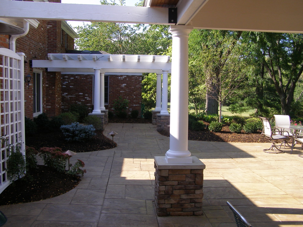Design ideas for a large traditional backyard patio in Cincinnati with a fire feature, concrete pavers and a pergola.