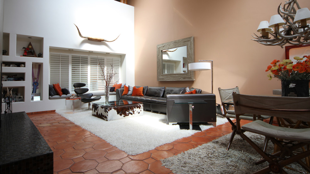 Design ideas for a large modern formal open concept living room in Dallas with orange walls, terra-cotta floors, no fireplace and no tv.