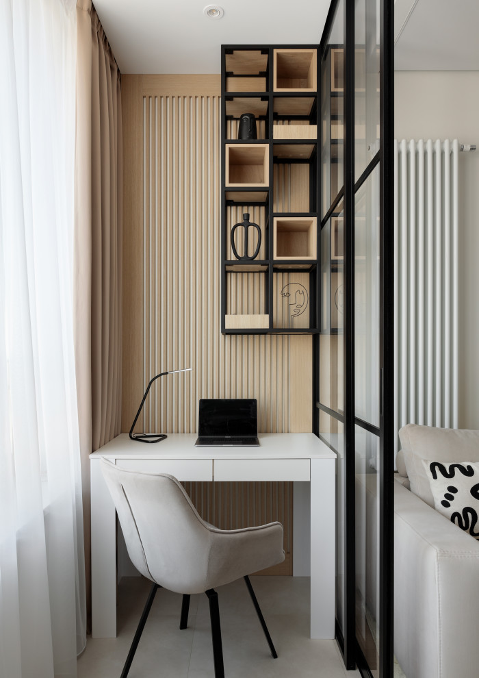 Photo of a contemporary home office in Moscow with a feature wall.