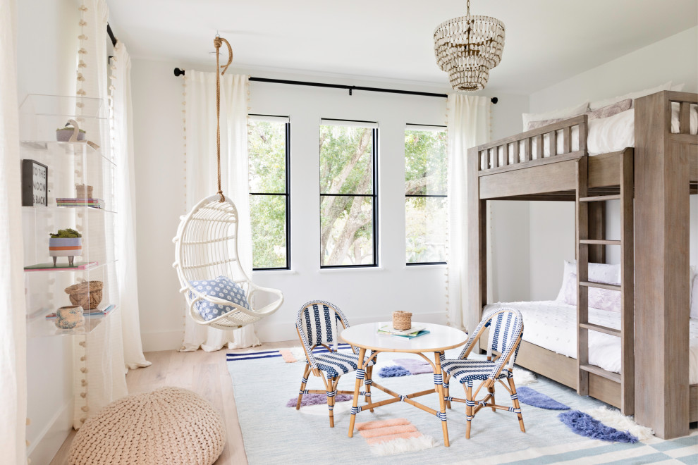 Inspiration for a large transitional kids' bedroom for kids 4-10 years old and girls in Orlando with white walls, light hardwood floors and beige floor.