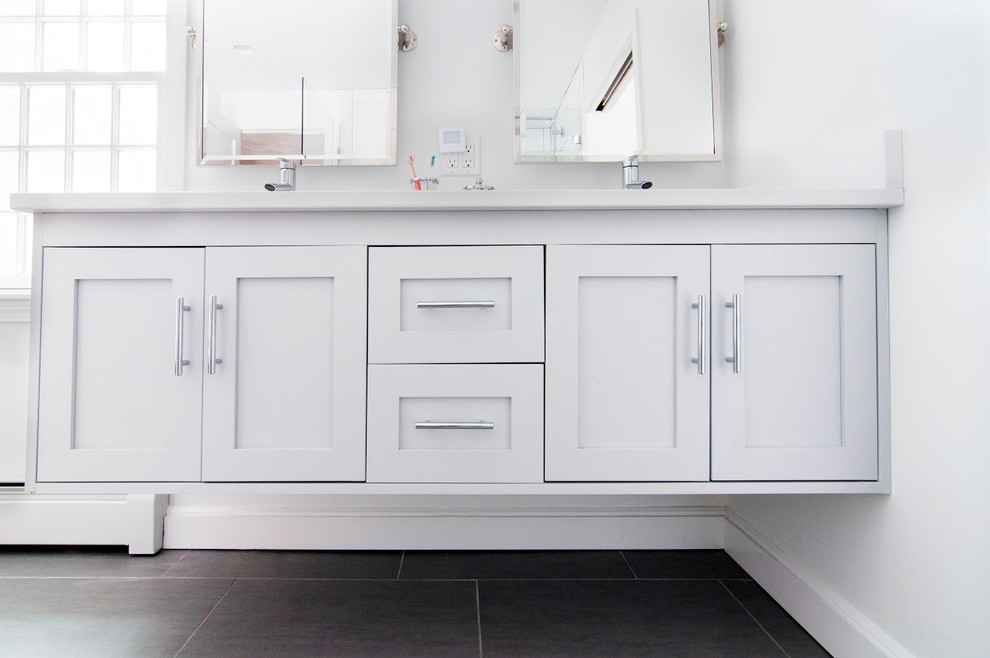 Inspiration for a large contemporary master bathroom in Boston with recessed-panel cabinets, grey cabinets, an open shower, white tile, ceramic tile, white walls, ceramic floors, an undermount sink, solid surface benchtops, grey floor and an open shower.