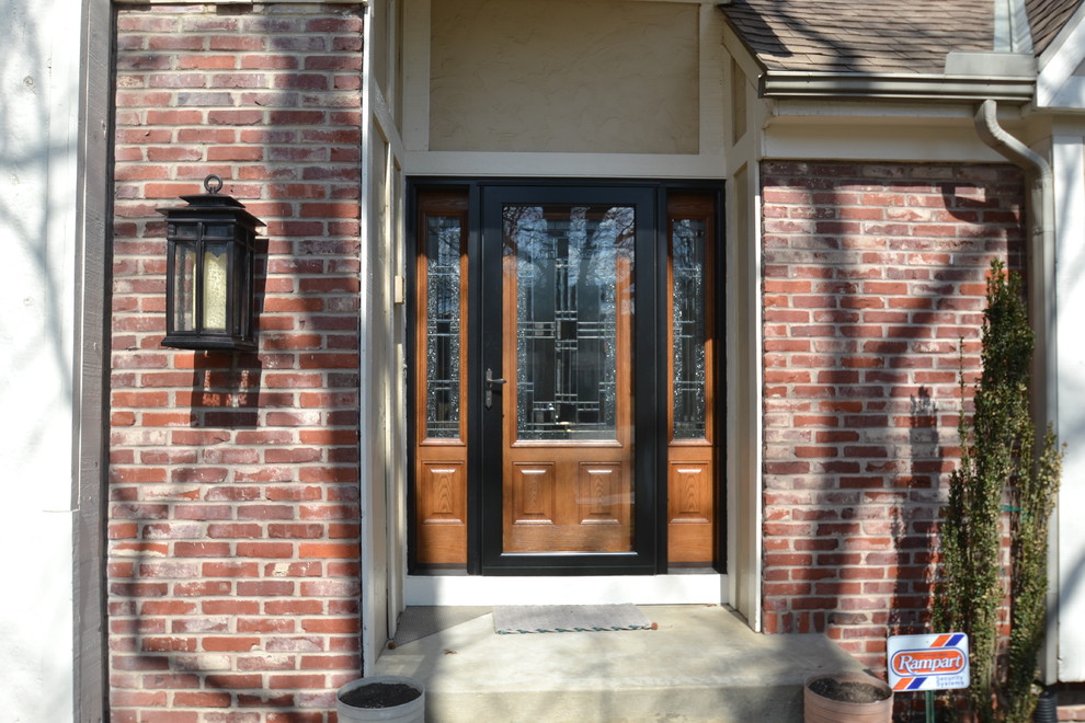 Traditional front door in Kansas City with a single front door and a medium wood front door.