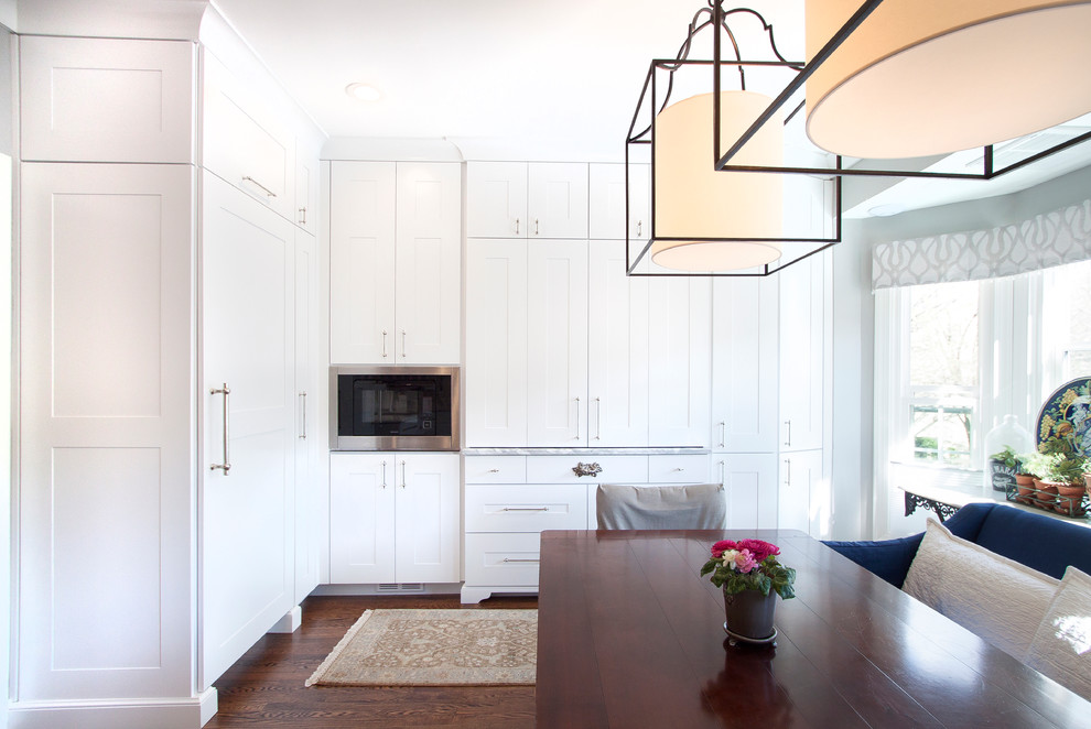 Inspiration for a small transitional eat-in kitchen remodel in DC Metro with white cabinets and marble countertops