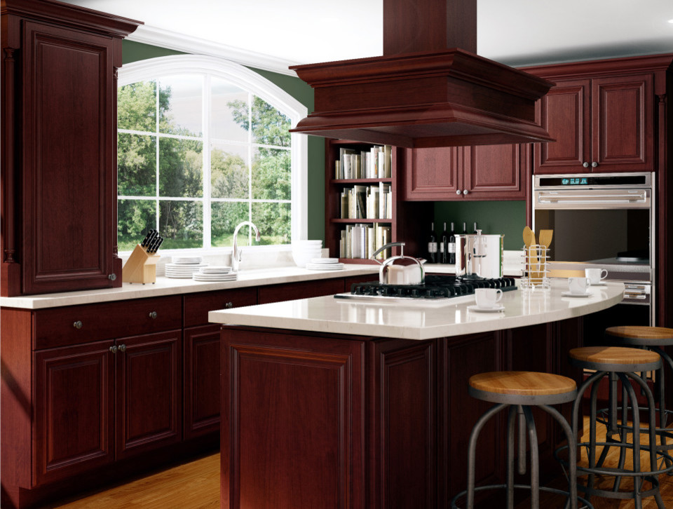 Mid-sized arts and crafts l-shaped medium tone wood floor and beige floor enclosed kitchen photo in Other with an undermount sink, raised-panel cabinets, dark wood cabinets, quartz countertops, stainless steel appliances, an island and white countertops