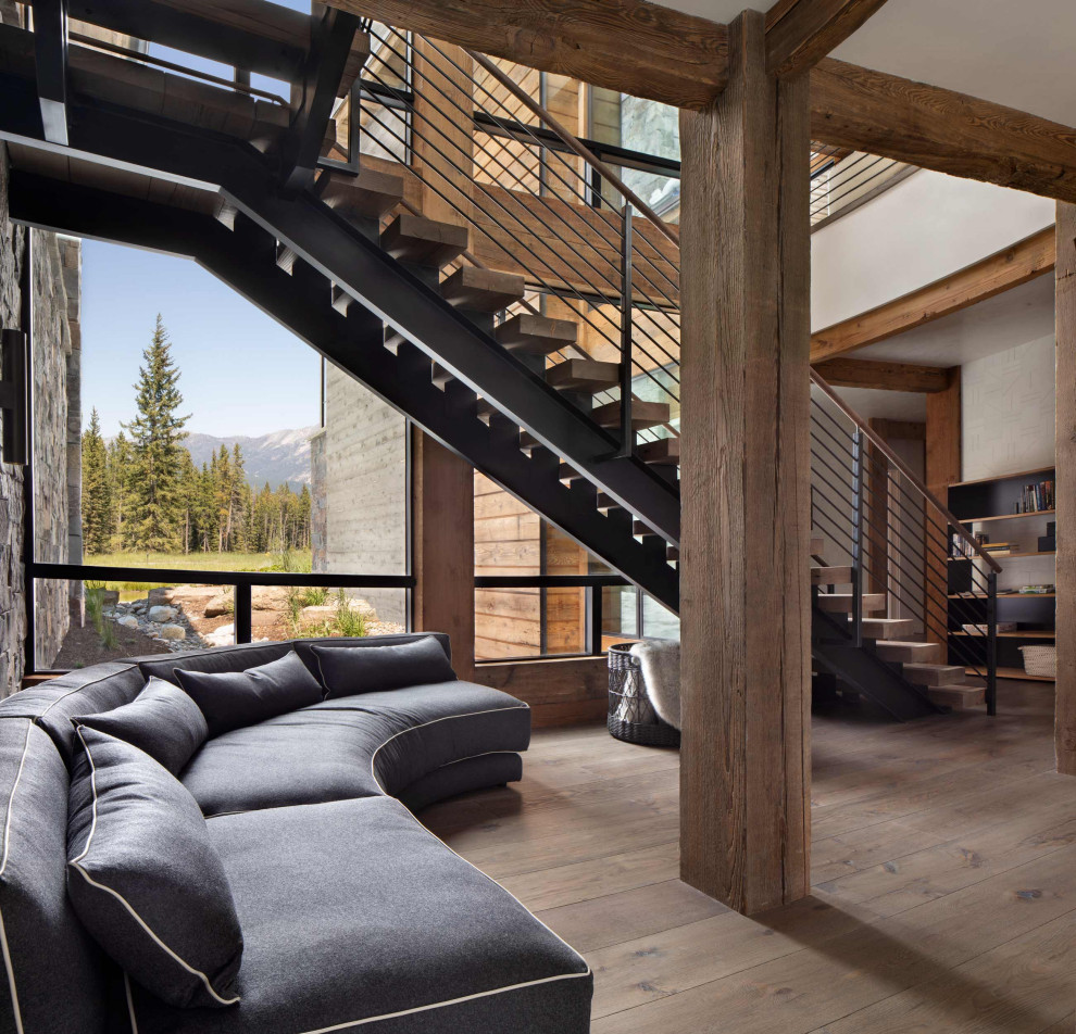 Example of a mountain style floating open and mixed material railing staircase design