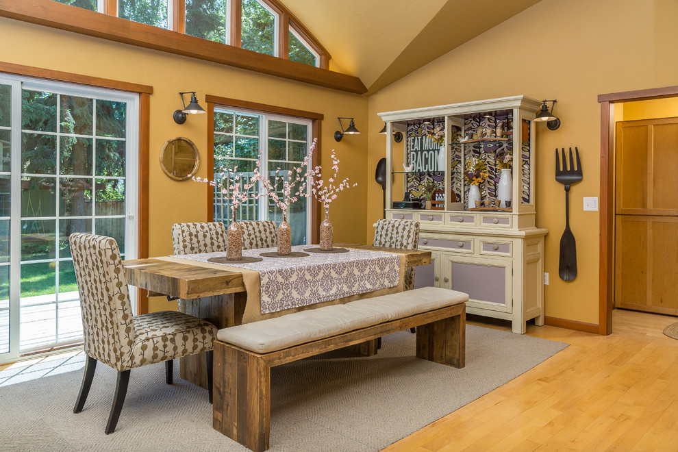 Inspiration for a mid-sized transitional light wood floor kitchen/dining room combo remodel with brown walls