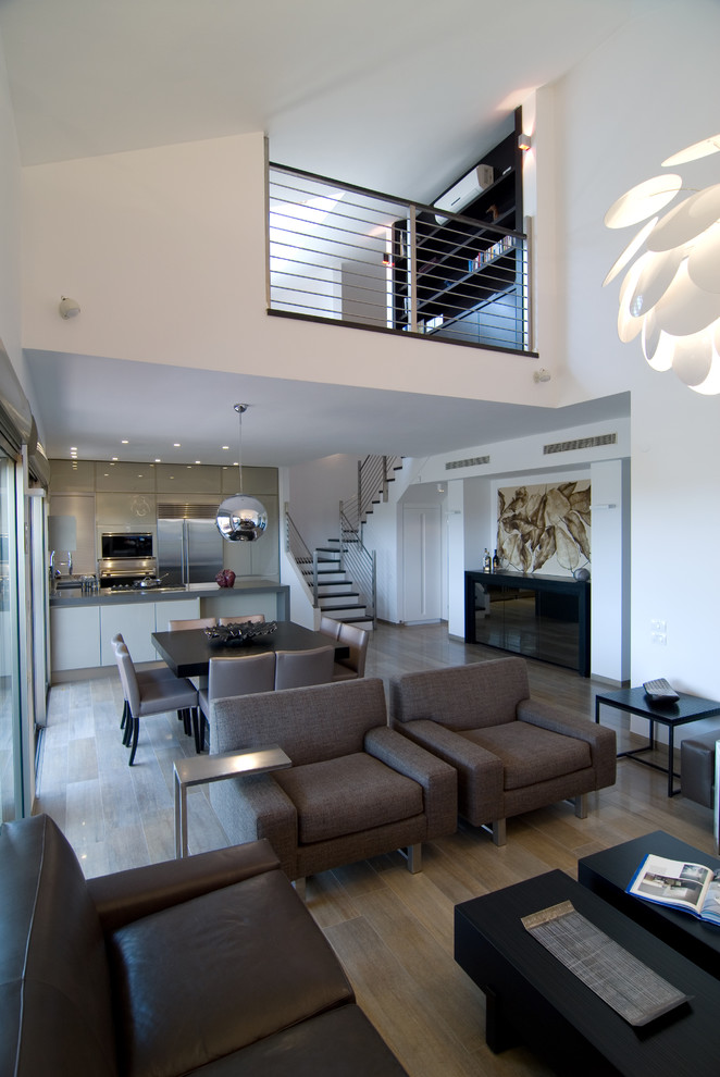 Design ideas for a contemporary open concept living room in Tel Aviv.
