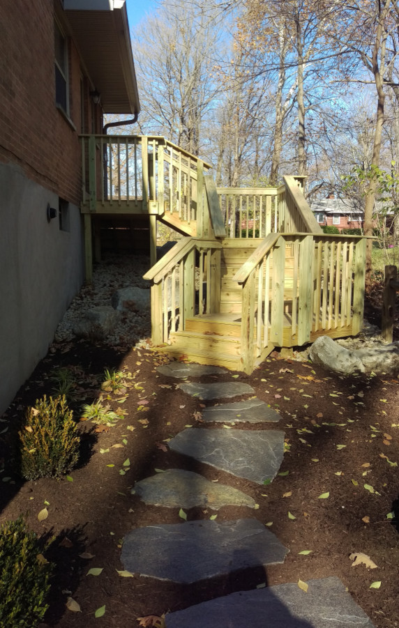 Deck - mid-sized transitional backyard deck idea with no cover