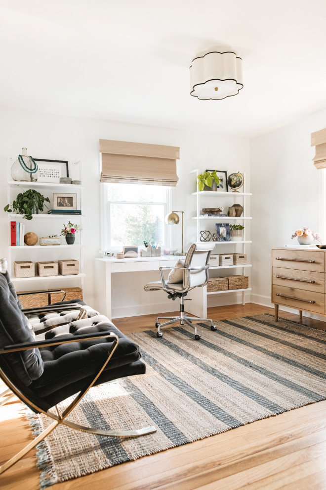 Example of a transitional home office design in Seattle