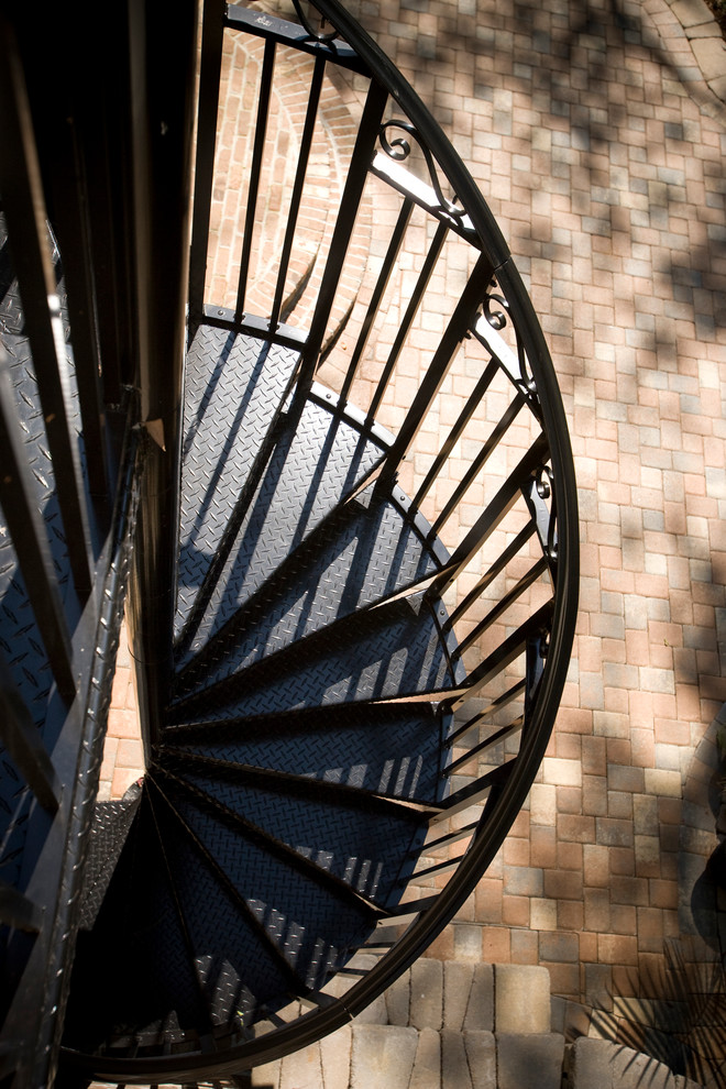 Photo of a traditional metal spiral staircase in Charleston with metal risers.