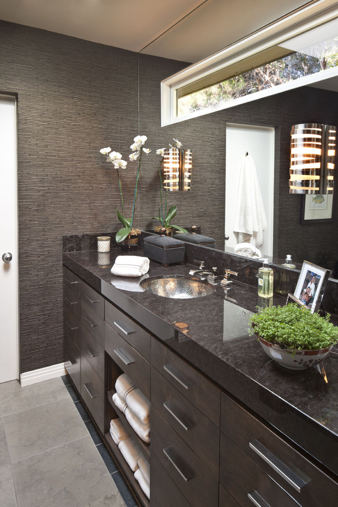 Design ideas for a contemporary bathroom in Los Angeles with an undermount sink, flat-panel cabinets, dark wood cabinets and brown tile.