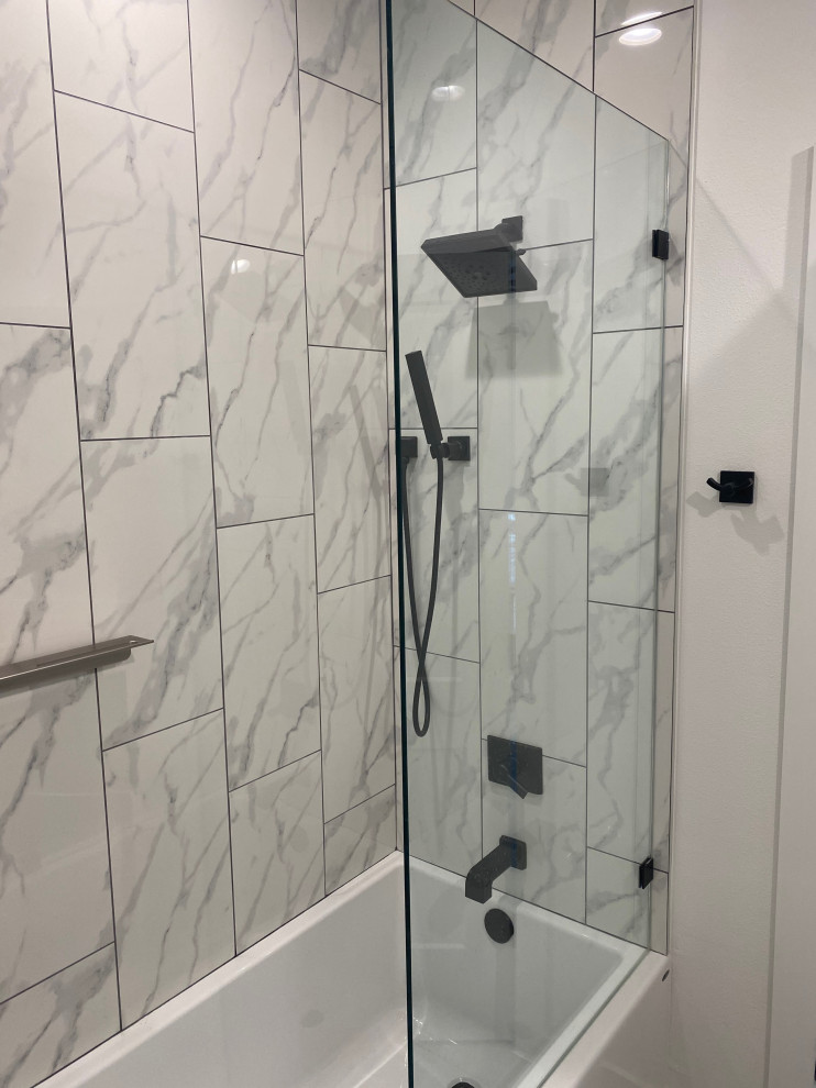 Large modern kids bathroom in Oklahoma City with an alcove tub, an alcove shower, a two-piece toilet, black and white tile, an undermount sink and an open shower.