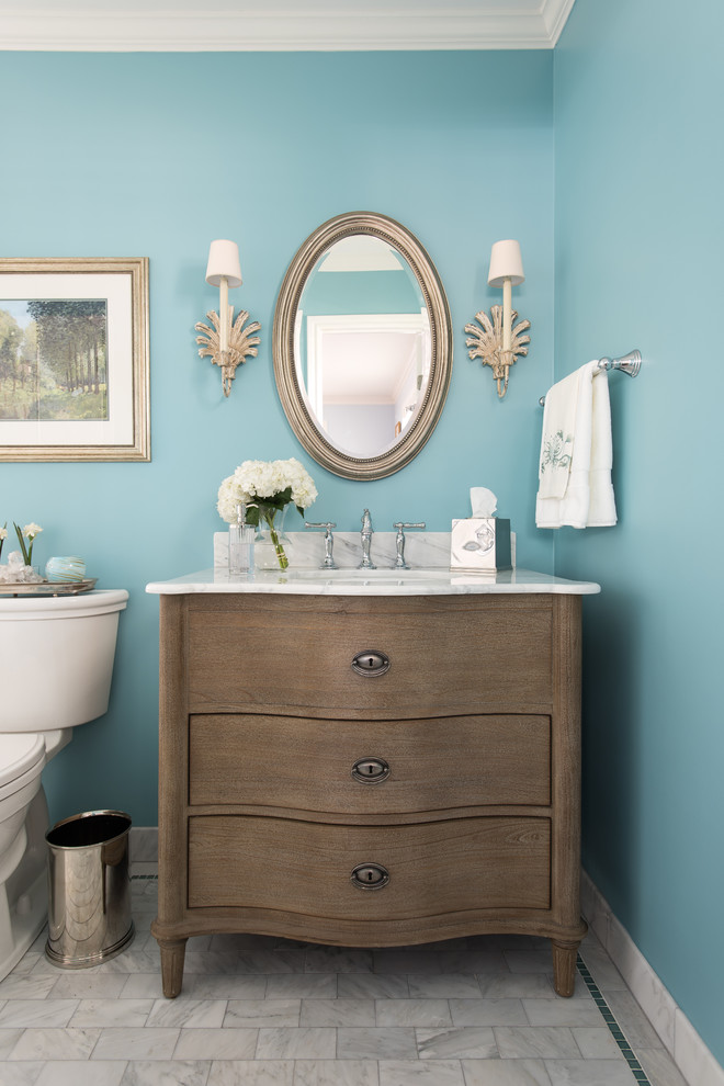 Design ideas for a mid-sized traditional 3/4 bathroom in Dallas with blue walls, an undermount sink, marble benchtops, white tile, stone tile, marble floors, a two-piece toilet, dark wood cabinets and flat-panel cabinets.