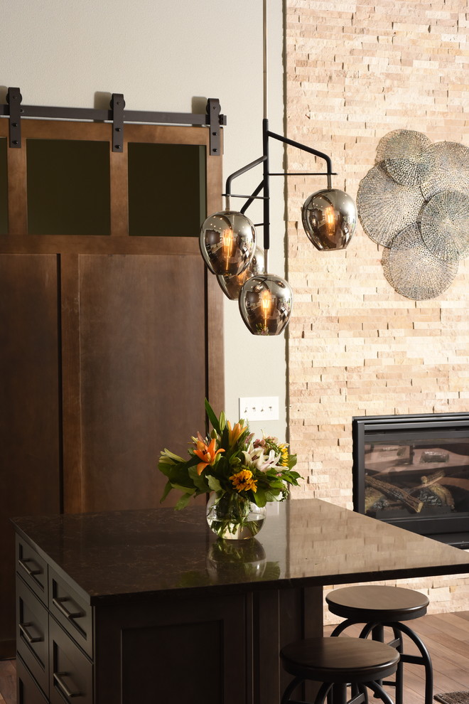Inspiration for a transitional galley medium tone wood floor kitchen remodel in Seattle with shaker cabinets, dark wood cabinets, quartzite countertops and two islands