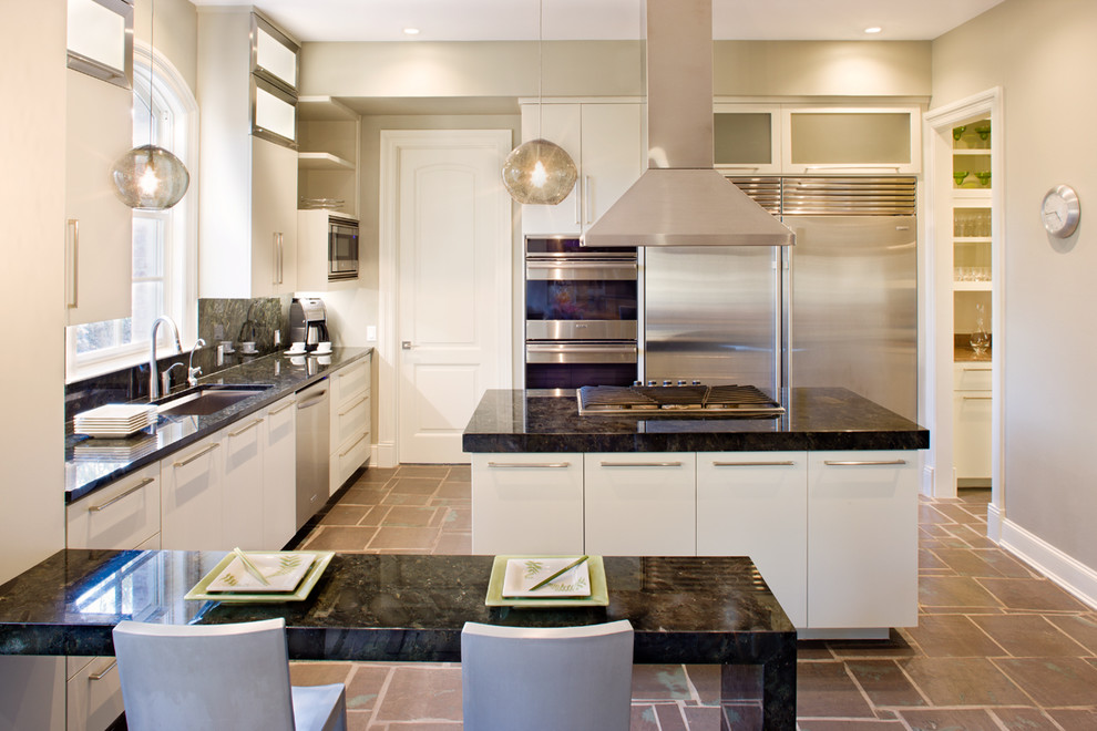 This is an example of a contemporary kitchen in Austin with stainless steel appliances and granite benchtops.