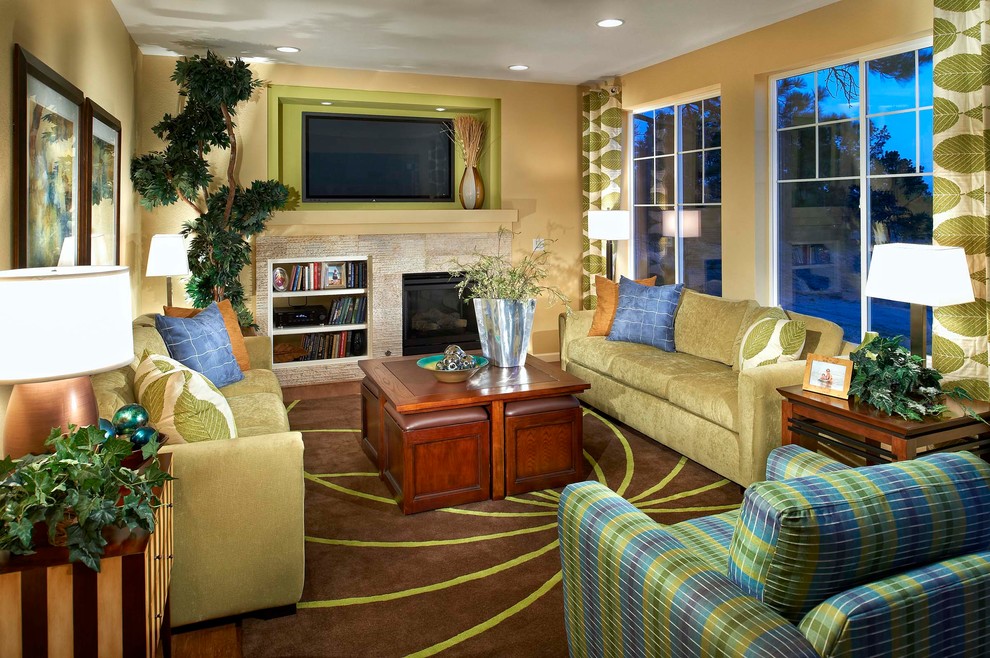 This is an example of a traditional enclosed living room in Denver with yellow walls and a wall-mounted tv.