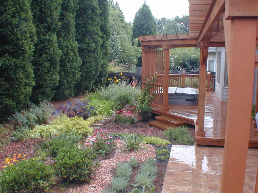 Inspiration for a small backyard full sun garden for summer in Atlanta with decking.