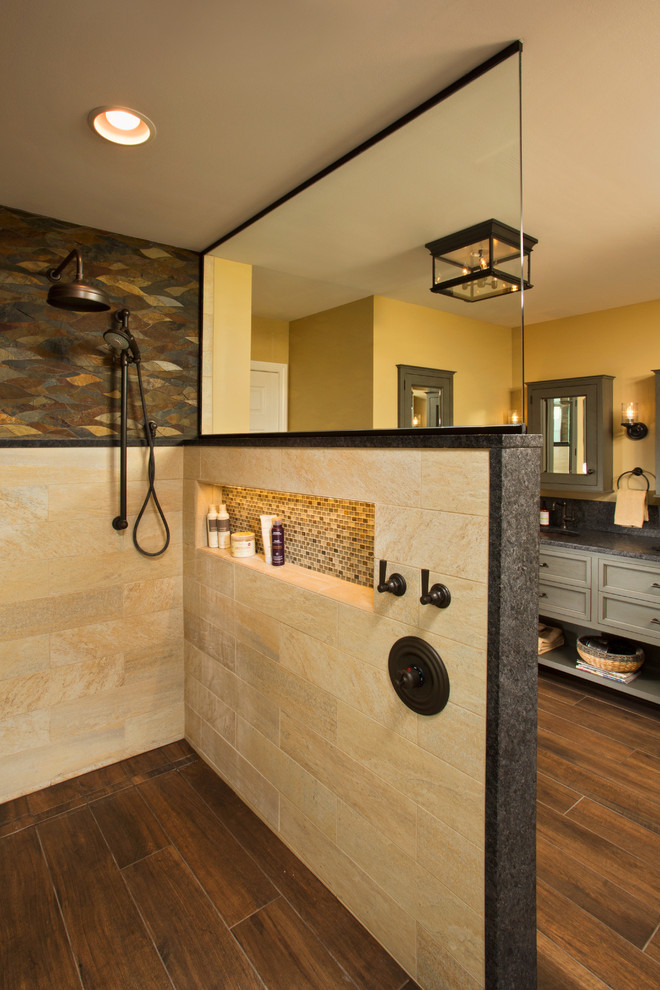 Design ideas for a mid-sized traditional master bathroom in Boston with recessed-panel cabinets, grey cabinets, an open shower, a two-piece toilet, multi-coloured tile, porcelain tile, yellow walls, medium hardwood floors, an undermount sink and marble benchtops.