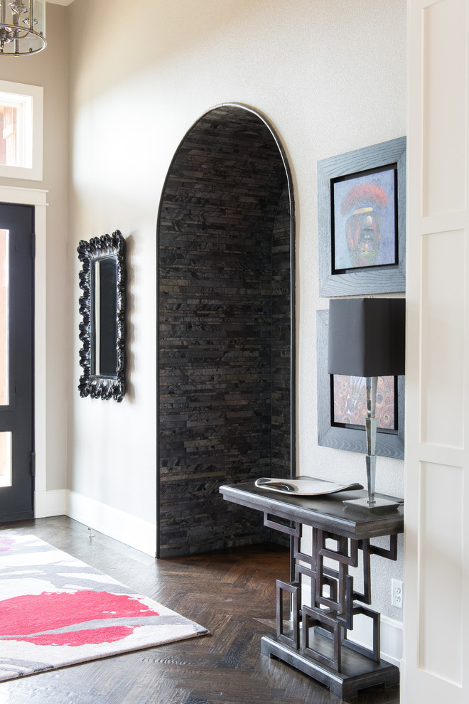 Inspiration for a large transitional hallway in Dallas with beige walls and dark hardwood floors.