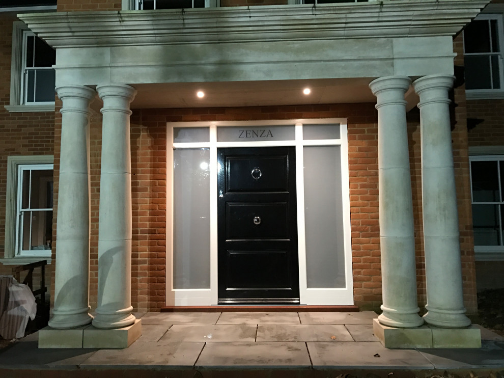 Elegant Stone Portico with bespoke hardwood entrance door