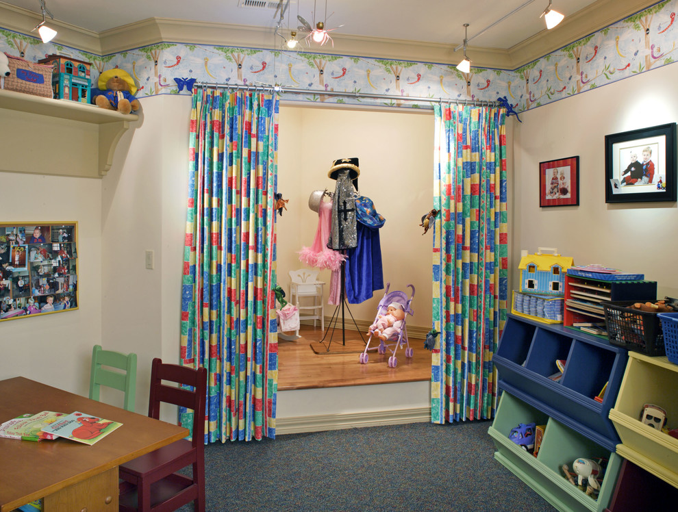 This is an example of a traditional gender-neutral kids' playroom in Omaha with beige walls and carpet.