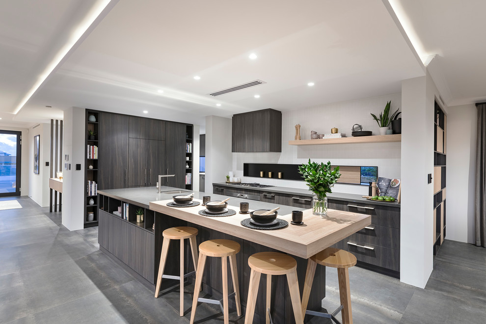 Asian l-shaped eat-in kitchen in Perth with an undermount sink, flat-panel cabinets, grey cabinets, stainless steel appliances, with island and grey floor.
