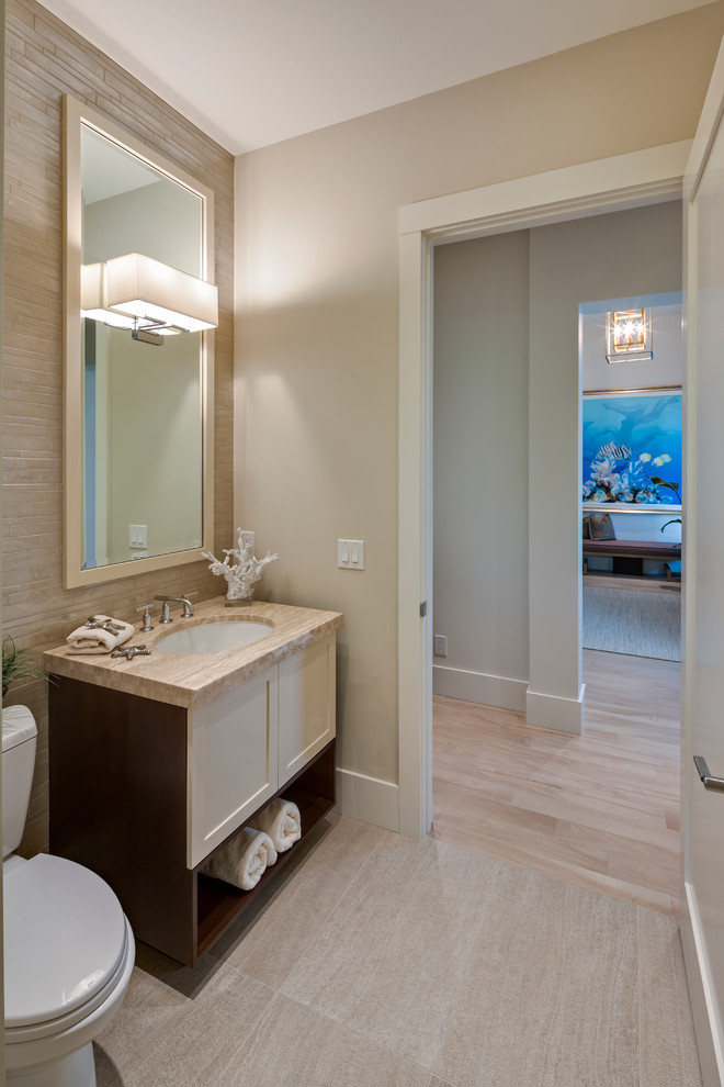 Design ideas for a large beach style powder room in Miami with an undermount sink, engineered quartz benchtops, a two-piece toilet, gray tile, porcelain tile, porcelain floors, beige walls, shaker cabinets and beige cabinets.