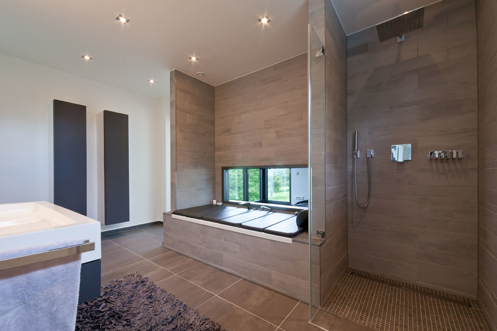 Inspiration for a large contemporary master bathroom in Cologne with an alcove shower, brown tile, white walls and a drop-in tub.
