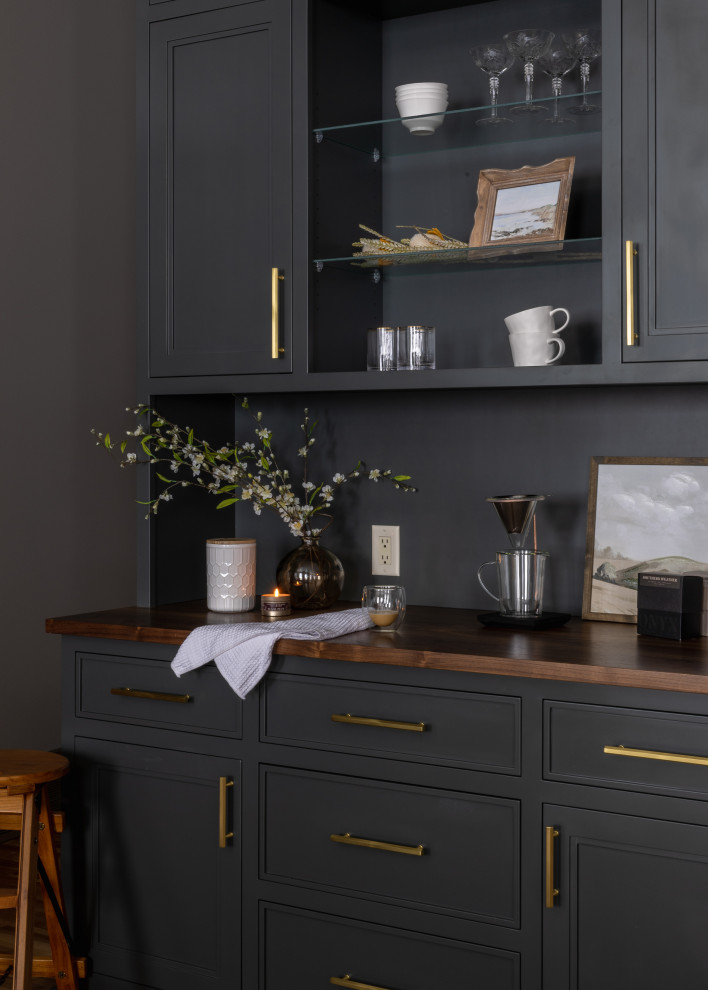 Inspiration for a mid-sized transitional l-shaped light wood floor and brown floor eat-in kitchen remodel with a farmhouse sink, shaker cabinets, blue cabinets, quartz countertops, white backsplash, quartz backsplash, black appliances, an island and white countertops