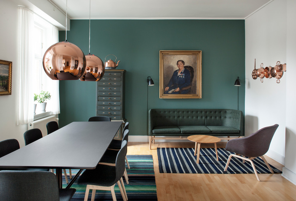 This is an example of a traditional living room in Copenhagen with green walls.