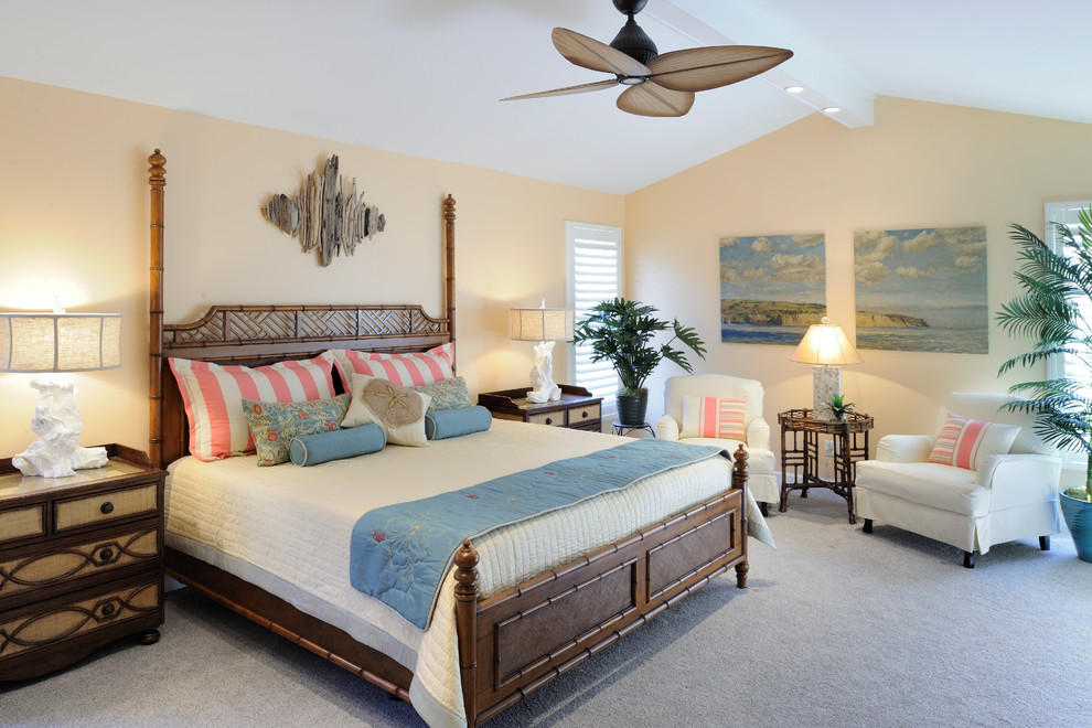 Photo of a mid-sized beach style master bedroom in St Louis with carpet, beige walls and grey floor.
